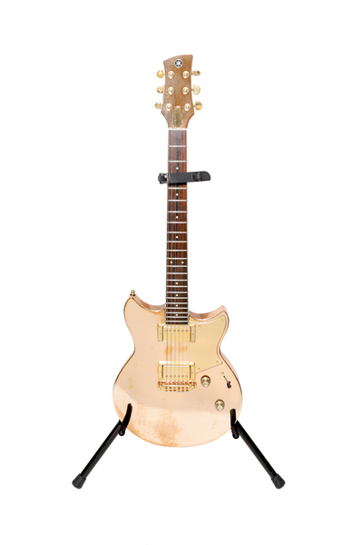 Gold_Yamaha_Revstar_electric_guitar_played_by_Shakira_on_El_Dorado_tour~0.jpg