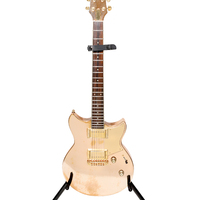 Gold_Yamaha_Revstar_electric_guitar_played_by_Shakira_on_El_Dorado_tour~0.jpg